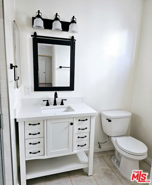 bathroom with vanity and toilet