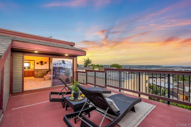 patio terrace at dusk with a balcony