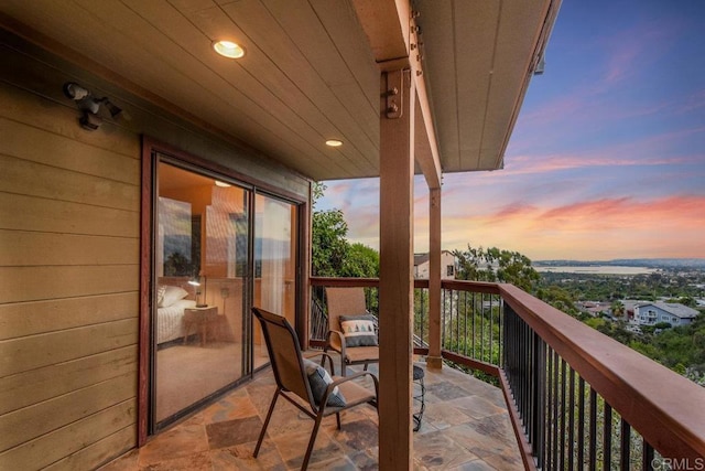 view of balcony at dusk