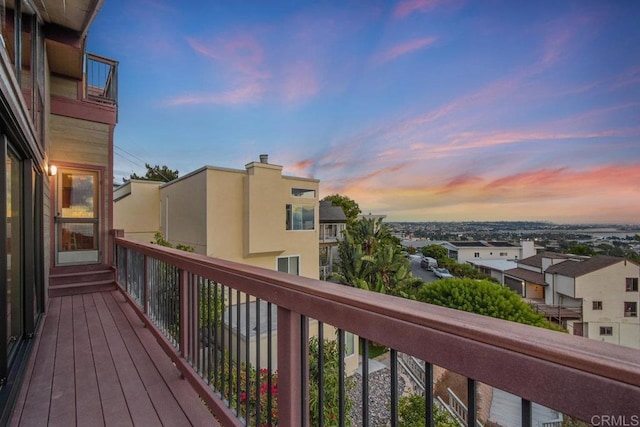 view of balcony at dusk