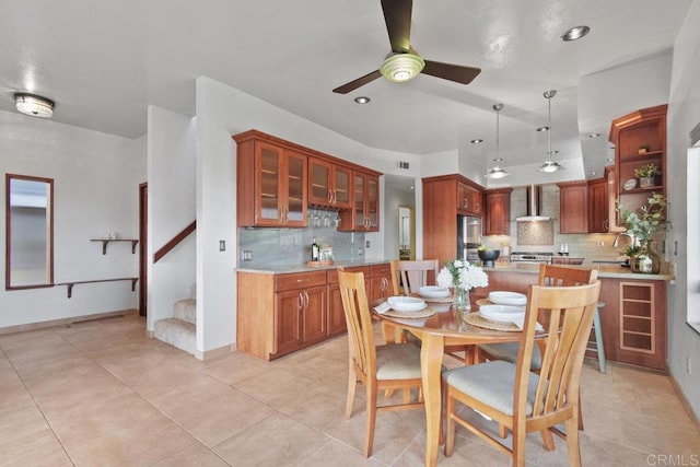 tiled dining room featuring ceiling fan