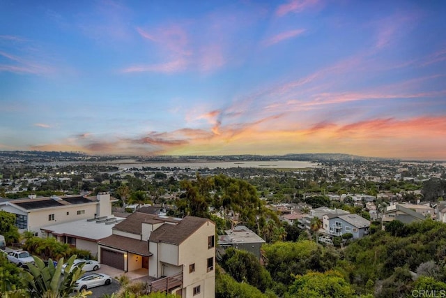 aerial view at dusk with a water view