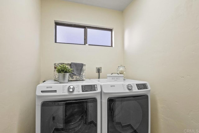 washroom featuring independent washer and dryer