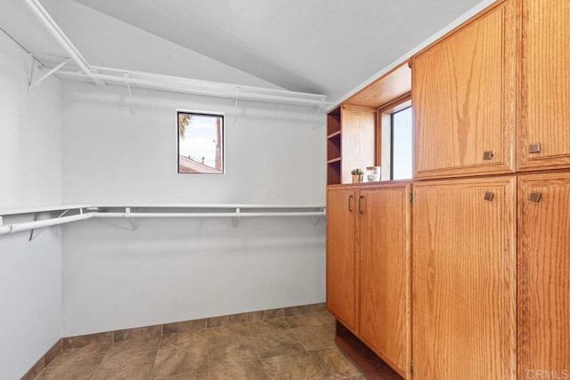 spacious closet featuring lofted ceiling