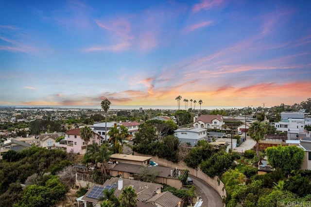 aerial view at dusk with a water view