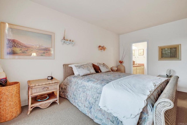 bedroom with carpet and ensuite bathroom