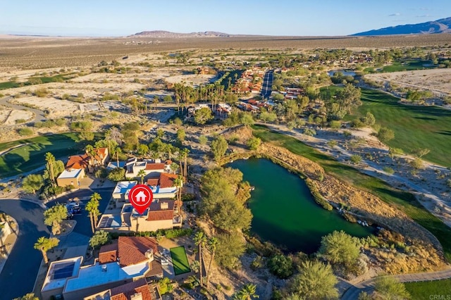 bird's eye view with a water and mountain view