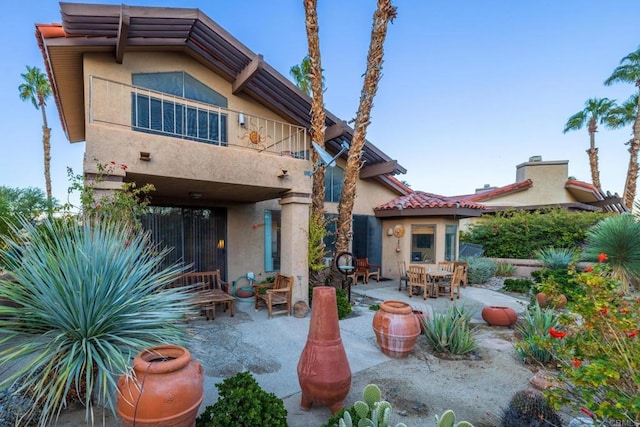 back of property with a patio area