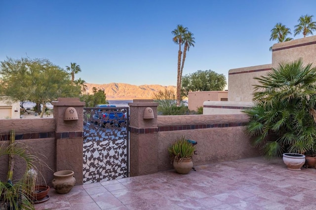 view of patio / terrace featuring a mountain view