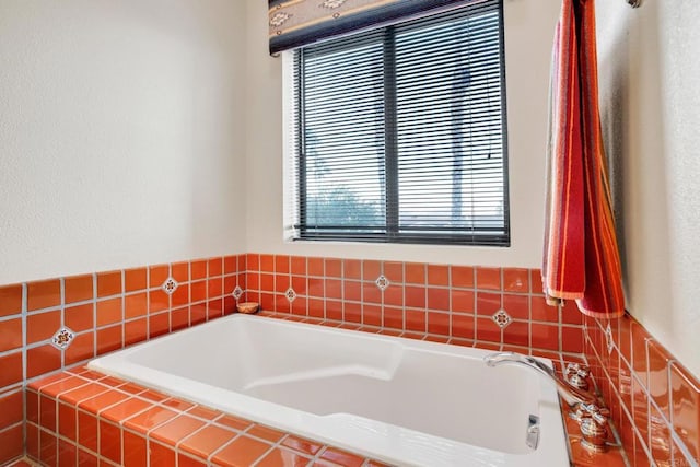 bathroom with tiled bath