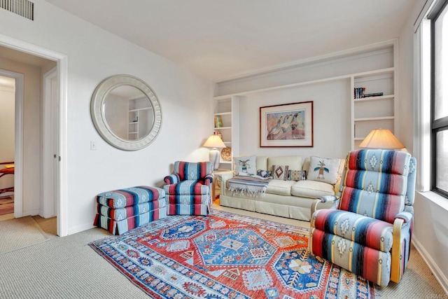 carpeted living room featuring a wealth of natural light