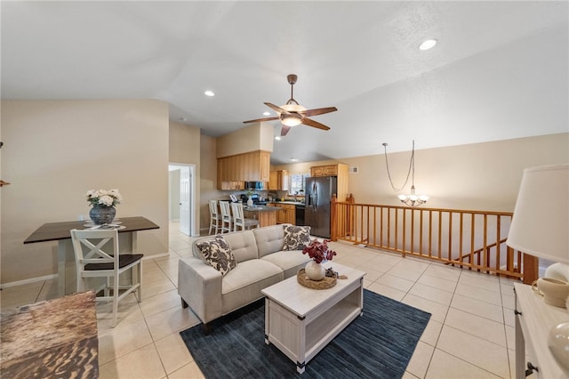 living area with vaulted ceiling, ceiling fan with notable chandelier, light tile patterned floors, and recessed lighting