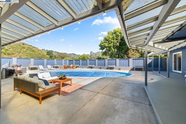 view of swimming pool featuring a patio area and an outdoor hangout area