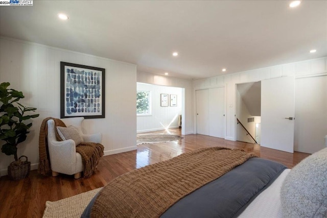 bedroom with hardwood / wood-style floors