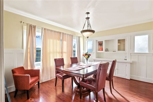 dining room featuring ornamental molding and wood-type flooring