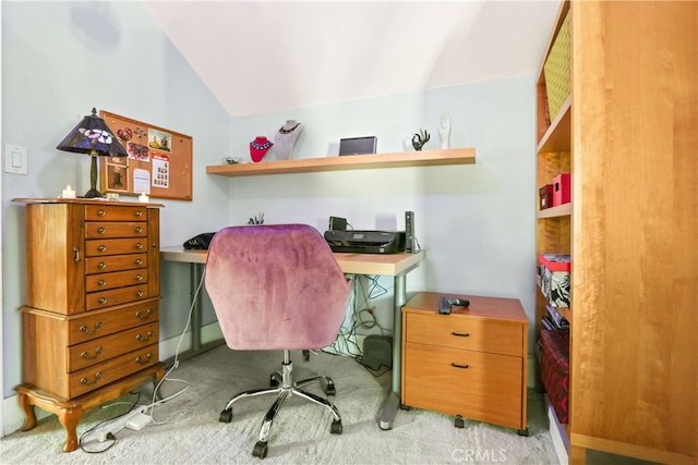 office area featuring vaulted ceiling and light colored carpet