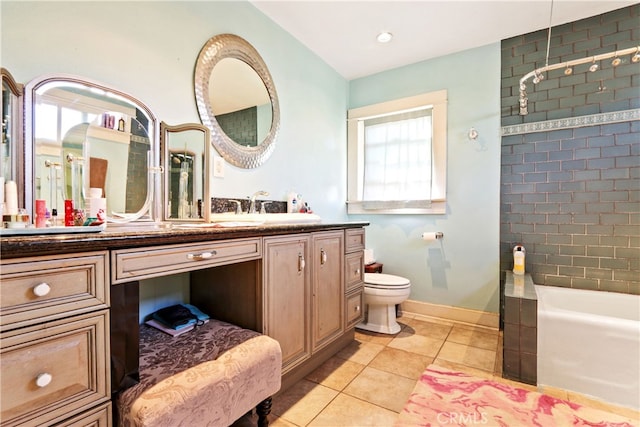 full bathroom featuring toilet, tiled shower / bath combo, vanity, and tile patterned flooring