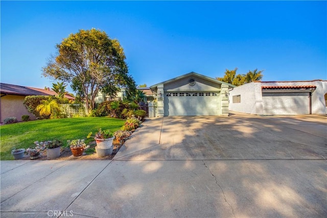 ranch-style house with a garage and a front lawn