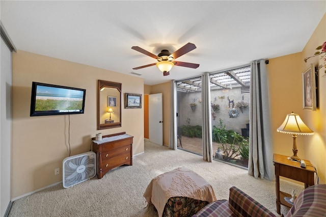 interior space featuring ceiling fan and light carpet