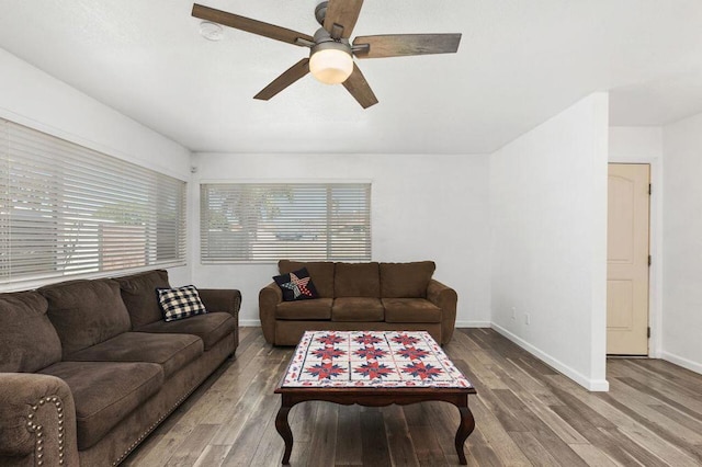 living room featuring ceiling fan, plenty of natural light, and hardwood / wood-style flooring