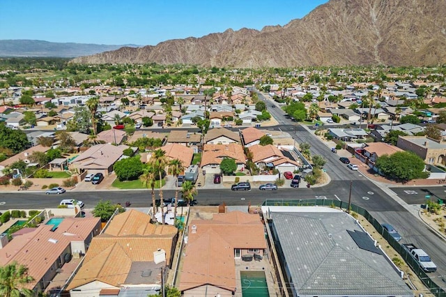 birds eye view of property with a mountain view