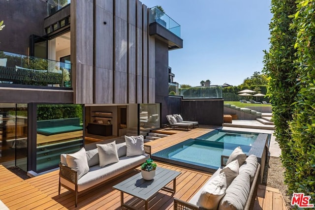 exterior space featuring a swimming pool and an outdoor hangout area