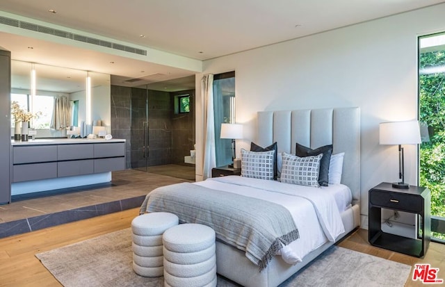 bedroom featuring hardwood / wood-style flooring