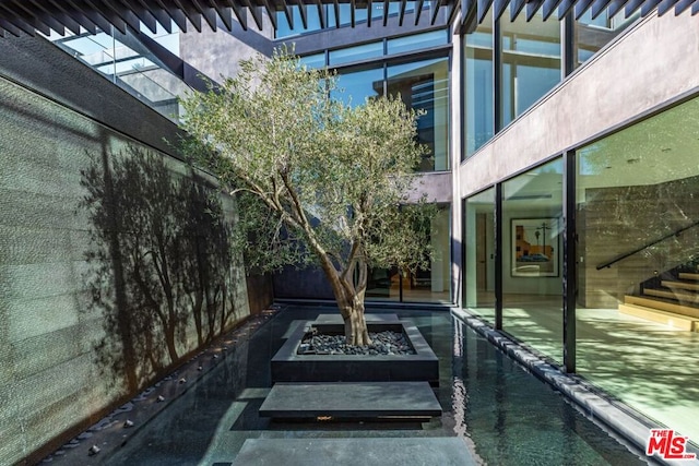 view of patio / terrace featuring an outdoor fire pit