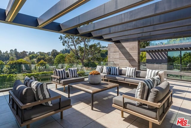 view of patio / terrace featuring an outdoor living space and a pergola