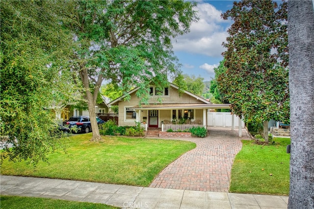 view of front of house with a front lawn and covered porch