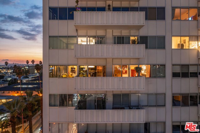 view of outdoor building at dusk