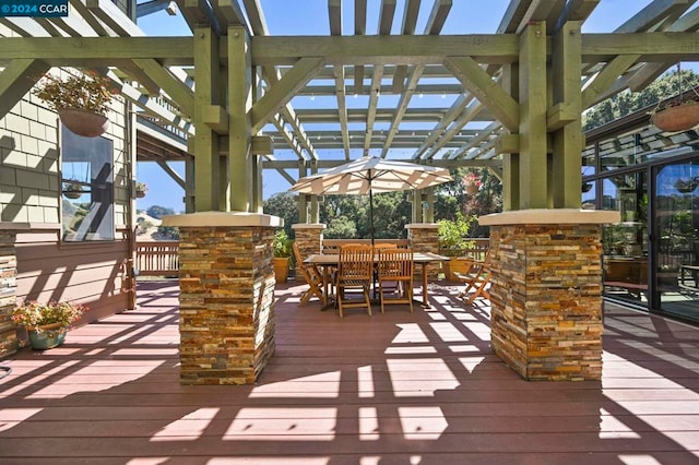 wooden terrace with a pergola