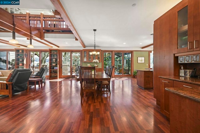 dining space featuring an inviting chandelier, dark hardwood / wood-style floors, beamed ceiling, and a wealth of natural light