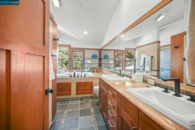 full bathroom featuring independent shower and bath, vanity, vaulted ceiling, and toilet