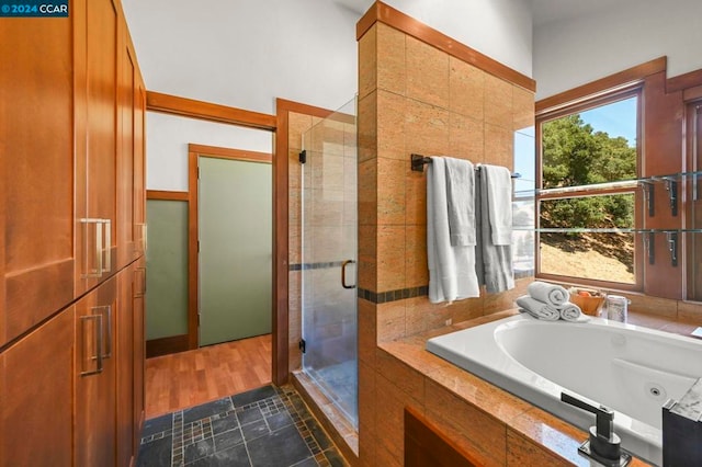 bathroom featuring independent shower and bath and tile patterned floors