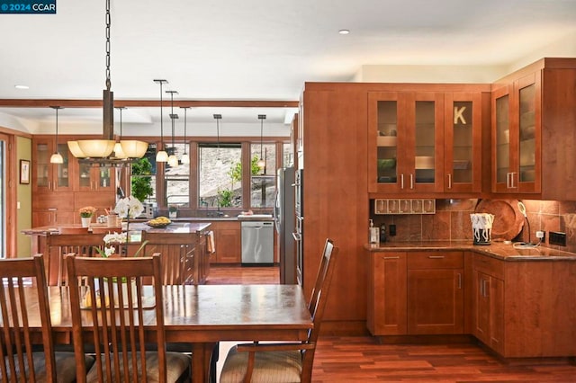 dining room with sink and dark wood-type flooring