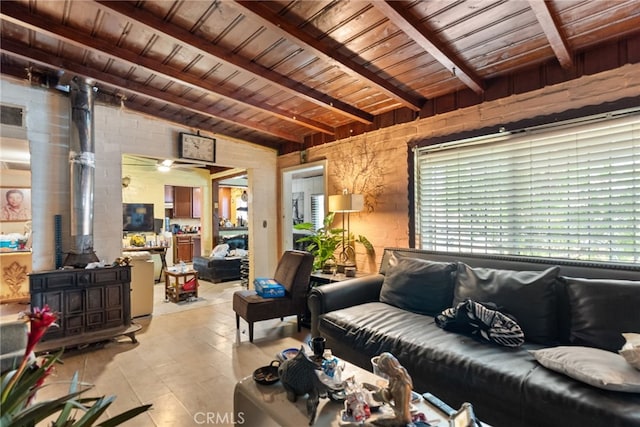 tiled living room with wooden ceiling, lofted ceiling with beams, and a wealth of natural light