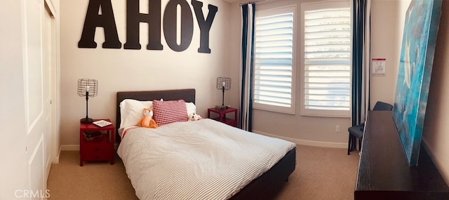 carpeted bedroom with multiple windows