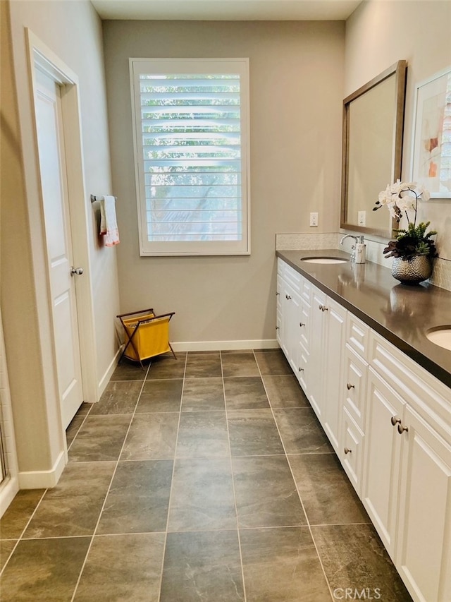 bathroom featuring vanity and tile patterned flooring