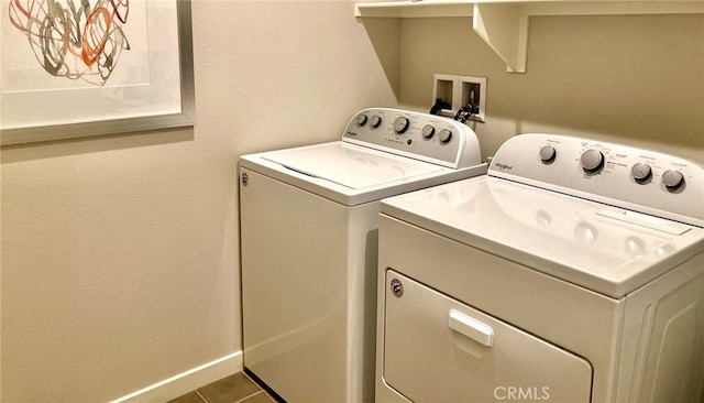 washroom featuring washer and dryer and tile patterned floors