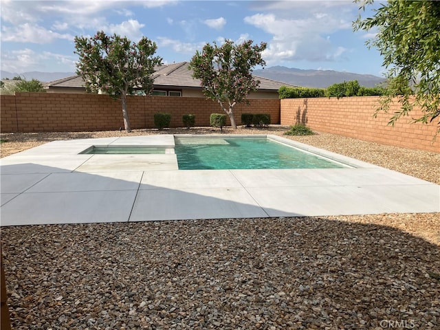 82611 Sagrada Ct, Indio, CA 92201 - view of pool with a fenced backyard, a patio, a fenced in pool, and a mountain view
