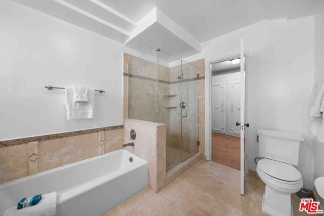 bathroom with tile patterned floors, toilet, and plus walk in shower