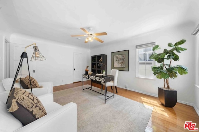 home office featuring ceiling fan and hardwood / wood-style floors