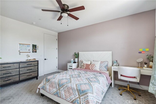 carpeted bedroom featuring ceiling fan