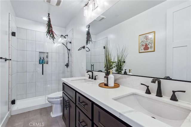 bathroom with vanity, toilet, and a shower with shower door