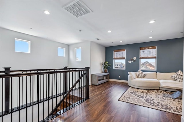 sitting room featuring dark wood-type flooring