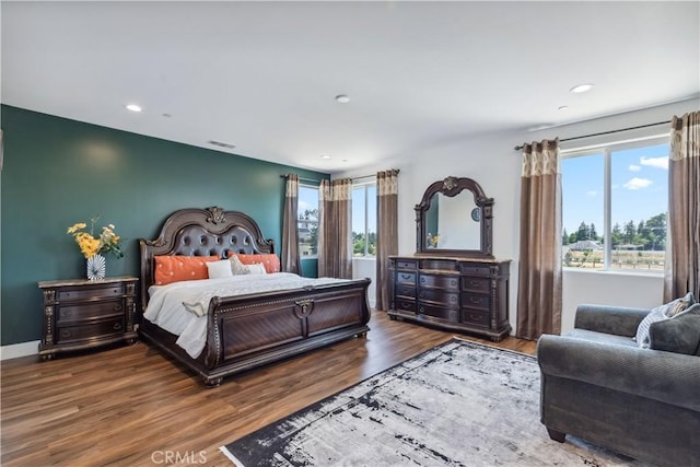 bedroom with hardwood / wood-style flooring