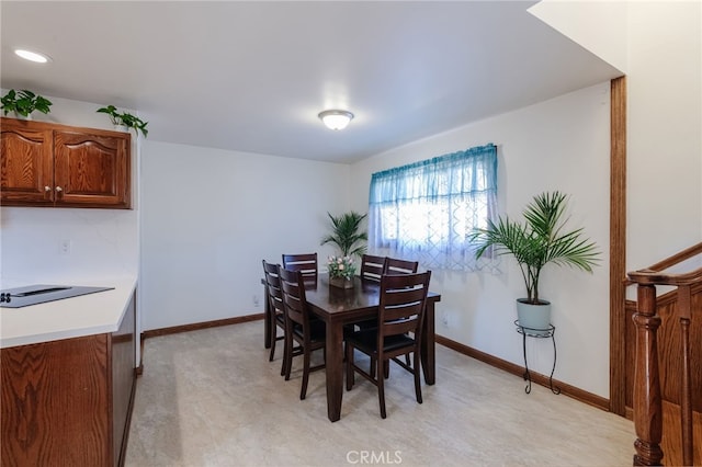 dining area featuring baseboards