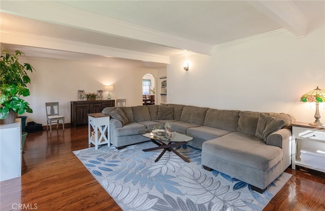 living room with crown molding, arched walkways, beamed ceiling, and wood finished floors