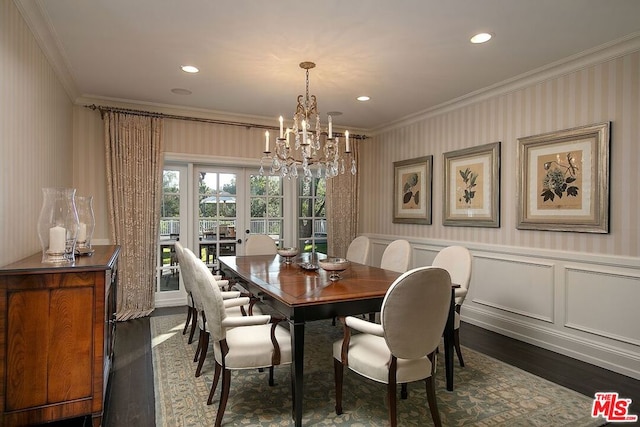 dining area featuring crown molding, a chandelier, and dark hardwood / wood-style flooring